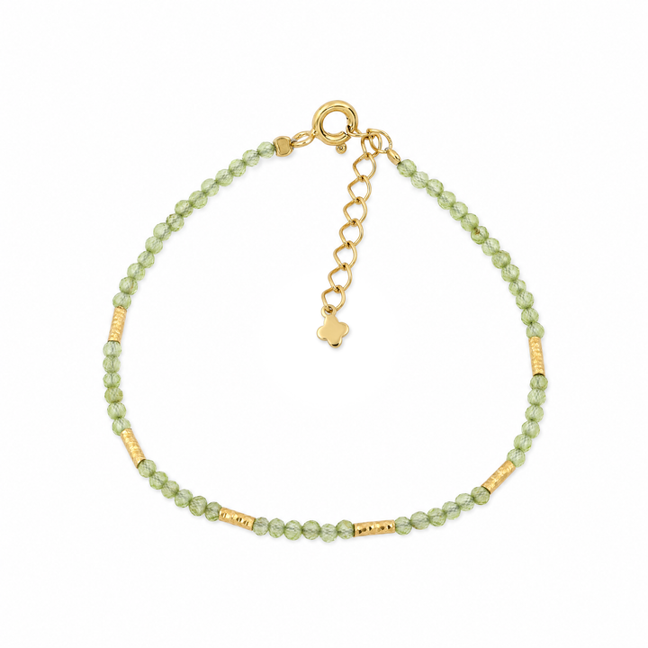 Armband "Marea" mit grünen facettierten Peridot-Perlen und vergoldeten Röhrchen